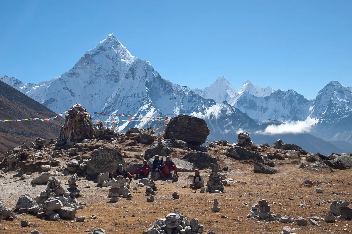 Ama Dablam behind stone cairns